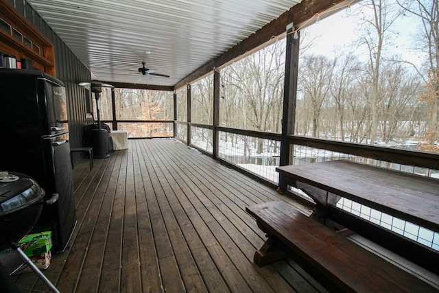 wooden deck with a ceiling fan