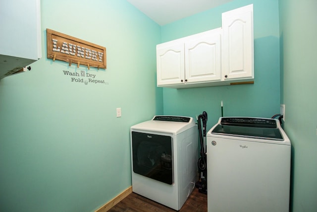 clothes washing area featuring cabinet space, washing machine and dryer, baseboards, and dark wood-style flooring