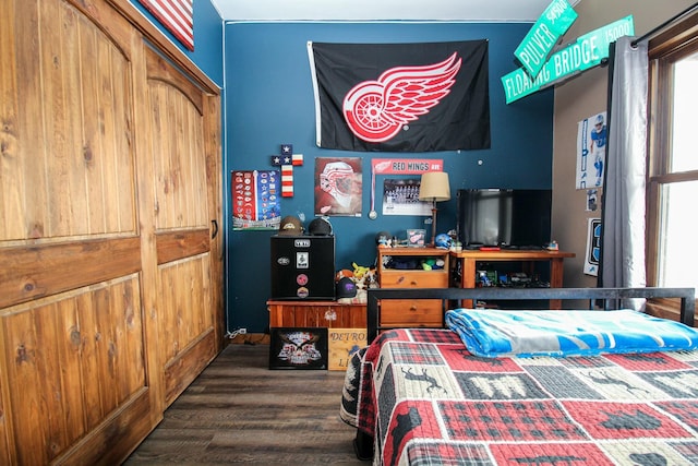 bedroom featuring wood finished floors