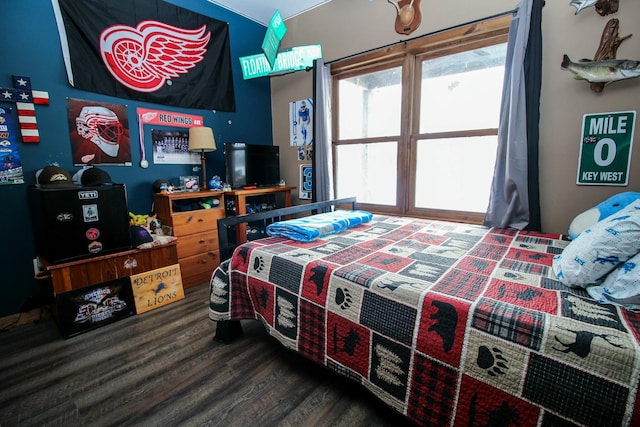 bedroom featuring wood finished floors