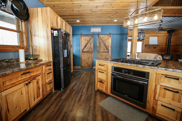 kitchen featuring dark wood-type flooring, wooden ceiling, black appliances, and a barn door