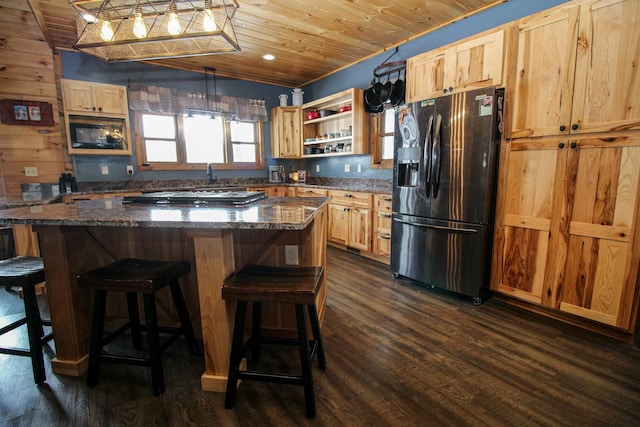 kitchen featuring wooden ceiling, dark wood-style floors, light brown cabinetry, open shelves, and black fridge