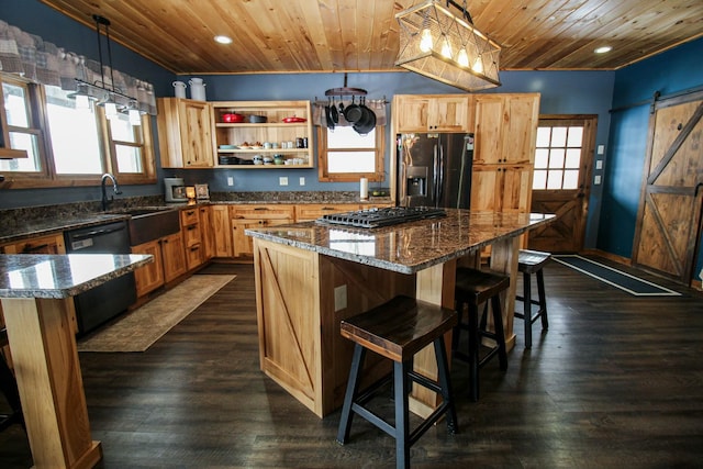 kitchen featuring a barn door, gas cooktop, wood ceiling, refrigerator with ice dispenser, and dishwasher