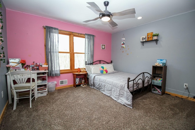 carpeted bedroom featuring baseboards, visible vents, and a ceiling fan