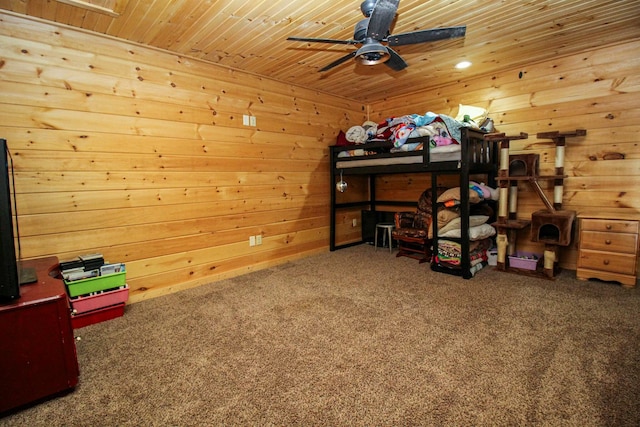 carpeted bedroom featuring wooden ceiling and wood walls