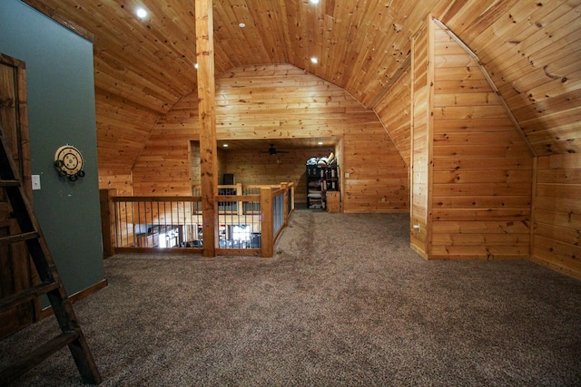 bonus room with lofted ceiling, wood ceiling, wooden walls, and carpet flooring