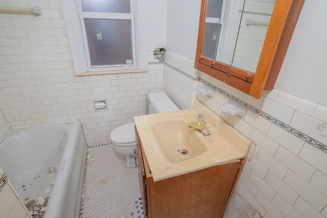 bathroom with a tub, tile walls, toilet, and vanity