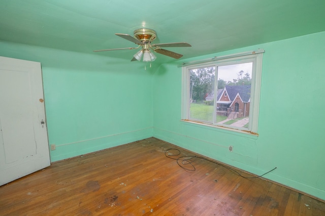 spare room with ceiling fan and wood-type flooring