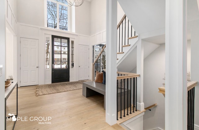 entryway featuring a high ceiling and wood finished floors