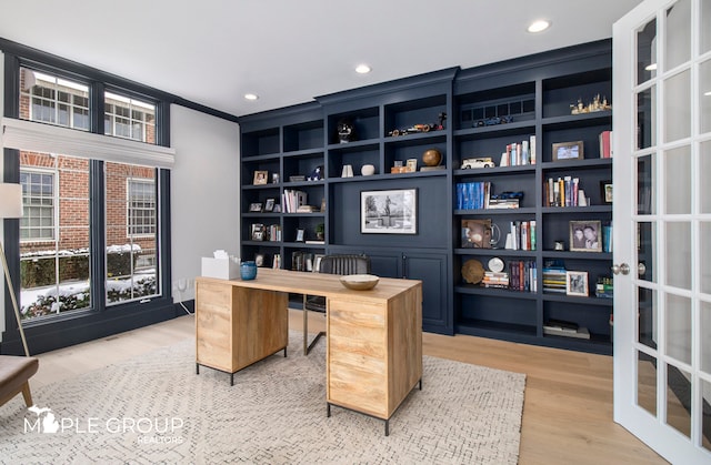 home office featuring recessed lighting, french doors, and light wood-style flooring