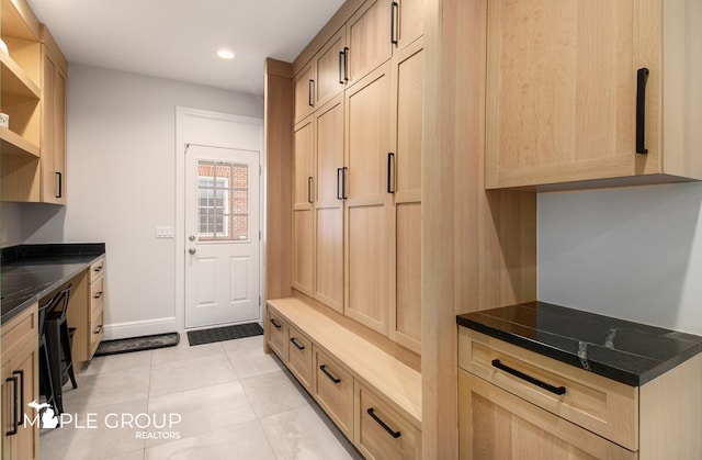 mudroom with light tile patterned floors, baseboards, and recessed lighting