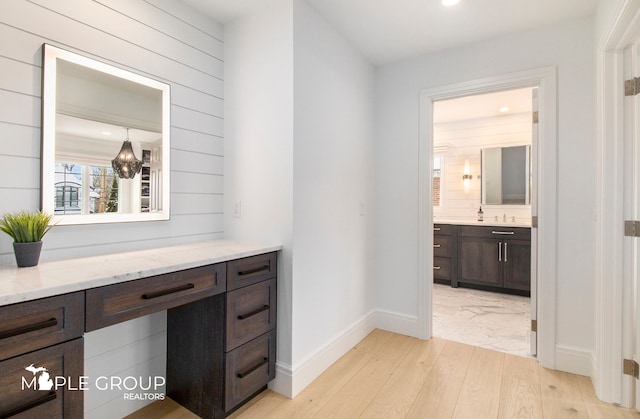 interior space with baseboards, recessed lighting, and light wood-style floors