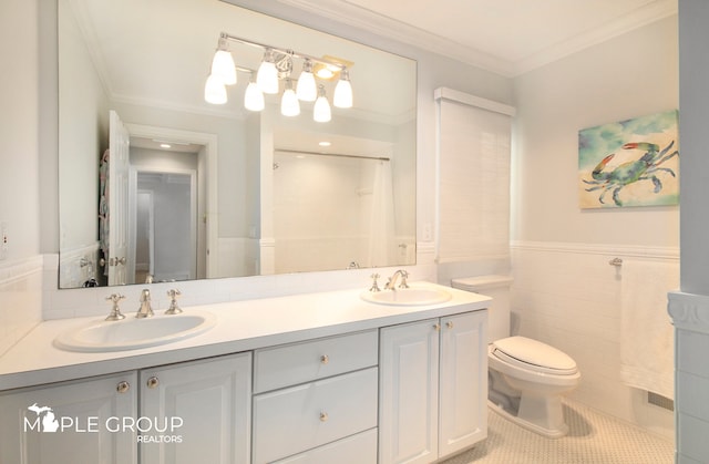 full bath featuring tile patterned floors, crown molding, a sink, and wainscoting