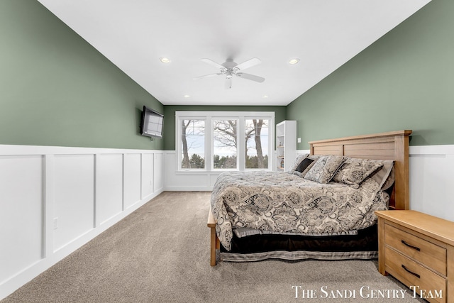 bedroom with a wainscoted wall, recessed lighting, ceiling fan, and light colored carpet