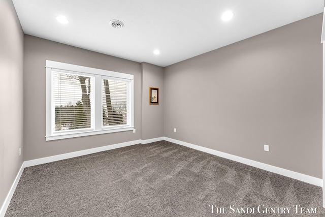 empty room with dark colored carpet, visible vents, baseboards, and recessed lighting