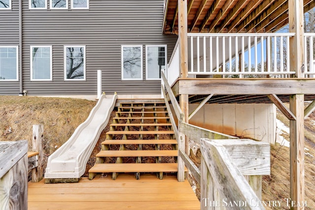 wooden terrace featuring stairway