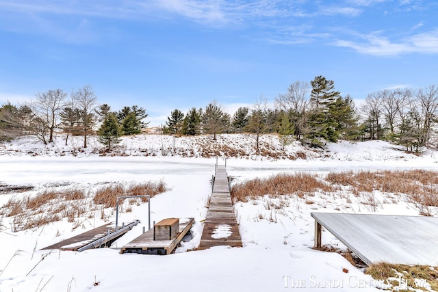 snowy yard featuring a boat dock