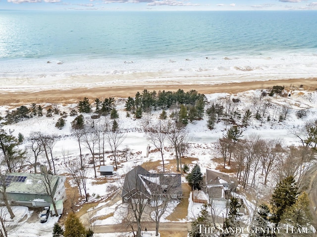 bird's eye view with a water view and a beach view