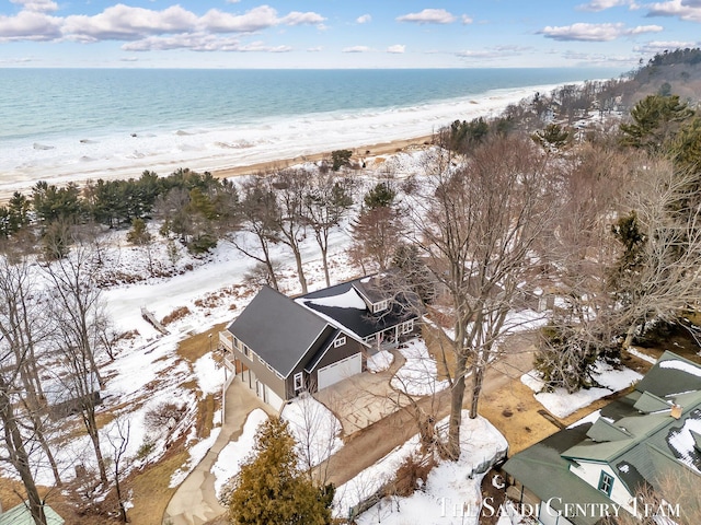 birds eye view of property featuring a water view and a view of the beach