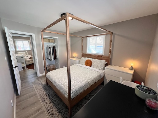 bedroom featuring a closet and light wood-type flooring