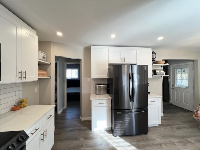 kitchen featuring white cabinets, open shelves, wood finished floors, and freestanding refrigerator