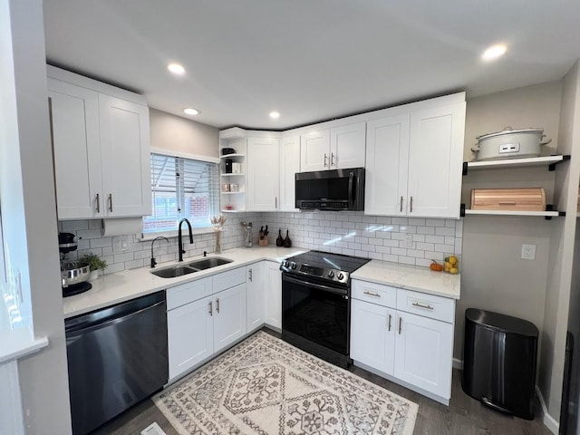 kitchen featuring open shelves, stainless steel dishwasher, white cabinets, a sink, and range with electric cooktop