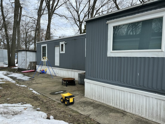 view of property exterior featuring an outbuilding and a shed