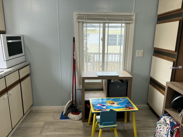 game room with light wood-style floors