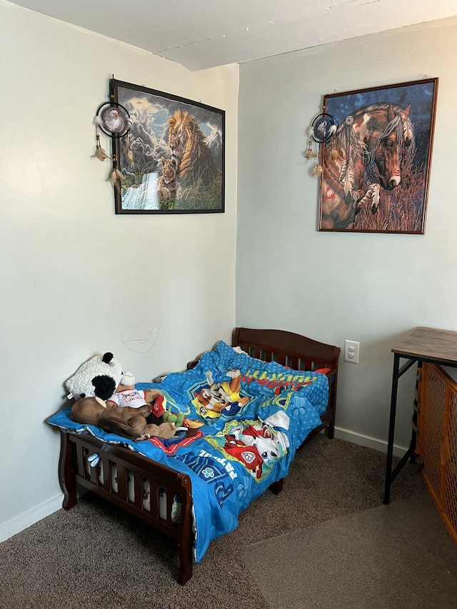 carpeted bedroom with baseboards