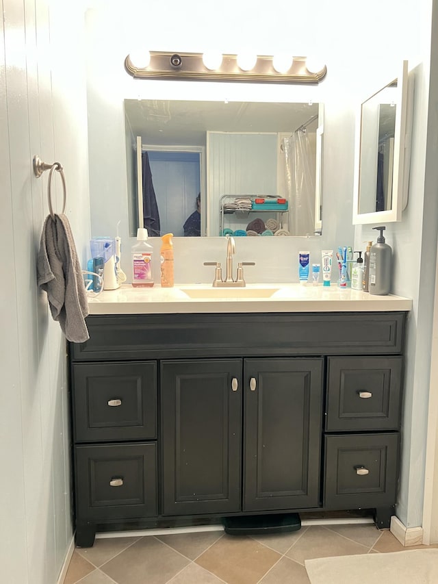 bathroom with vanity and tile patterned floors