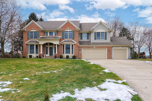 view of front of home with a garage, a front lawn, concrete driveway, and brick siding