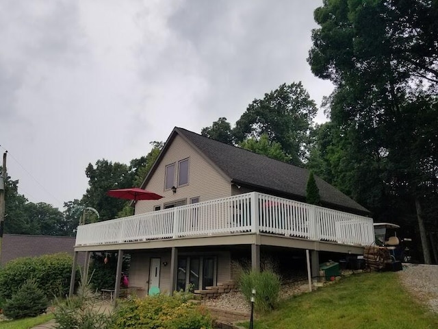 back of house featuring a deck