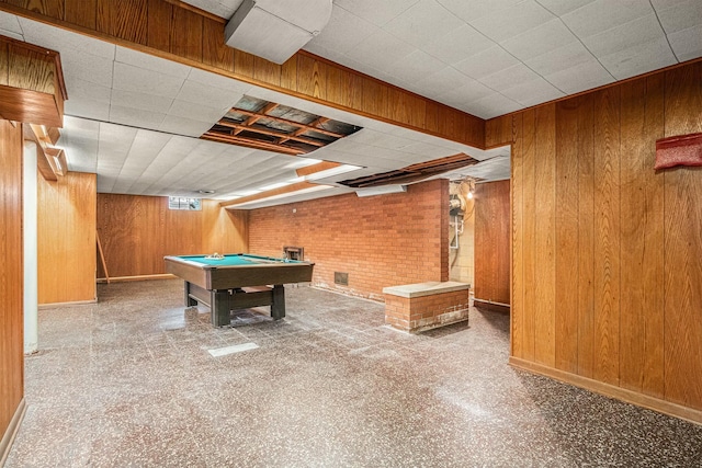 recreation room with wood walls, baseboards, and billiards