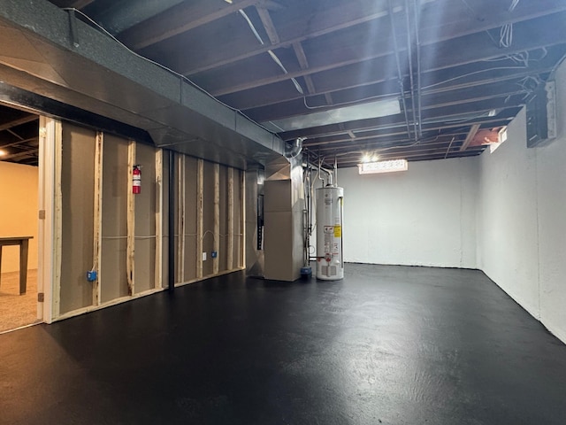 unfinished basement featuring heating unit and water heater