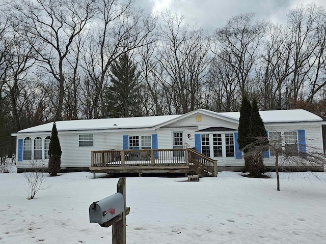 manufactured / mobile home featuring a deck and a sunroom