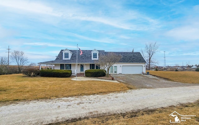 view of front facade with a front yard, roof with shingles, driveway, and an attached garage