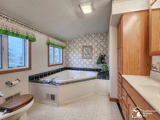 full bath featuring wallpapered walls, visible vents, lofted ceiling, tile patterned floors, and a whirlpool tub