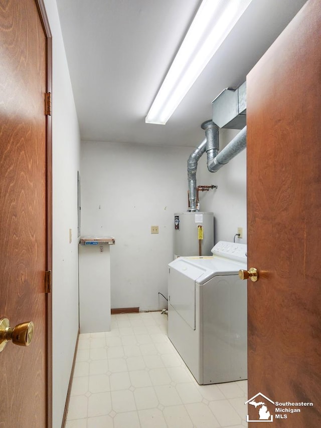 laundry area featuring laundry area, light floors, and gas water heater