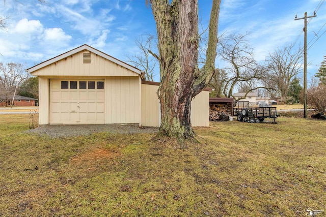 detached garage featuring driveway