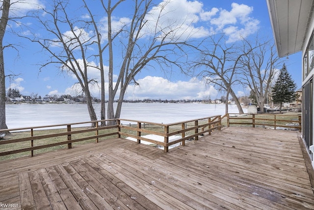 wooden deck featuring a water view