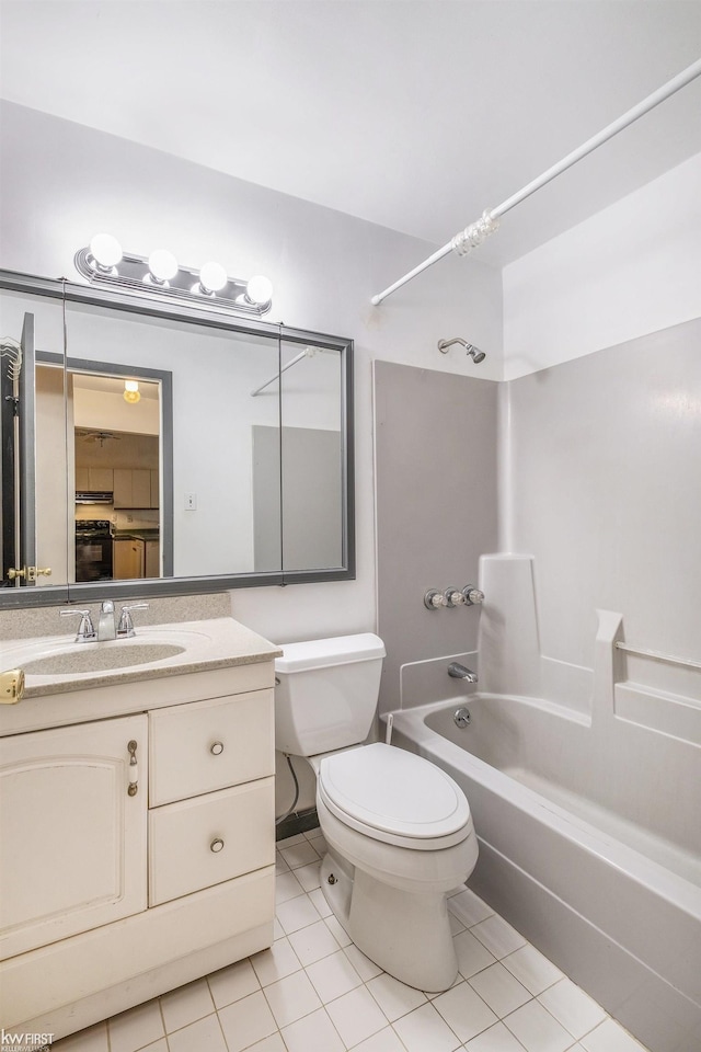 full bath featuring shower / bath combination, vanity, toilet, and tile patterned floors