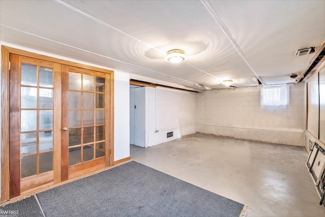 basement featuring concrete block wall