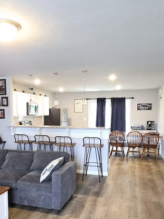 living area with dark wood-style flooring