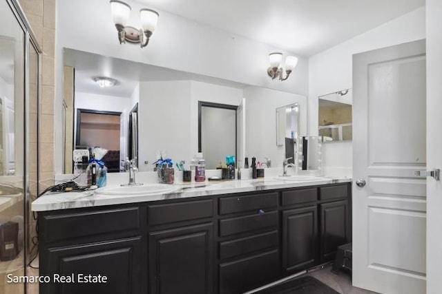 ensuite bathroom featuring a sink, a shower stall, ensuite bath, and double vanity