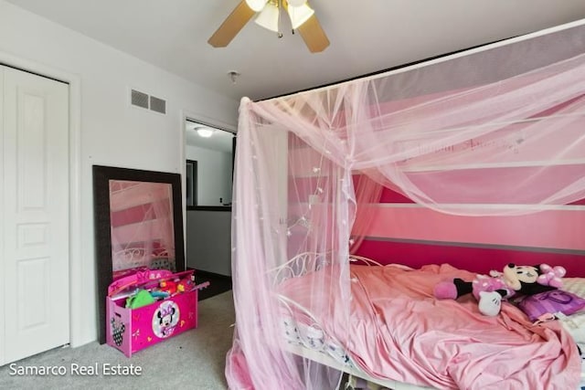 carpeted bedroom with visible vents and ceiling fan