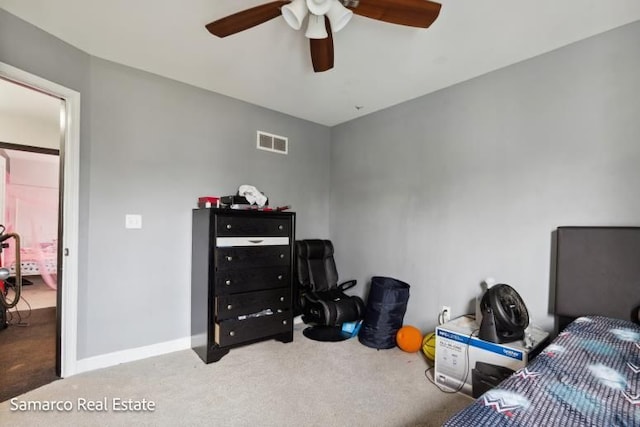 bedroom with a ceiling fan, carpet flooring, visible vents, and baseboards