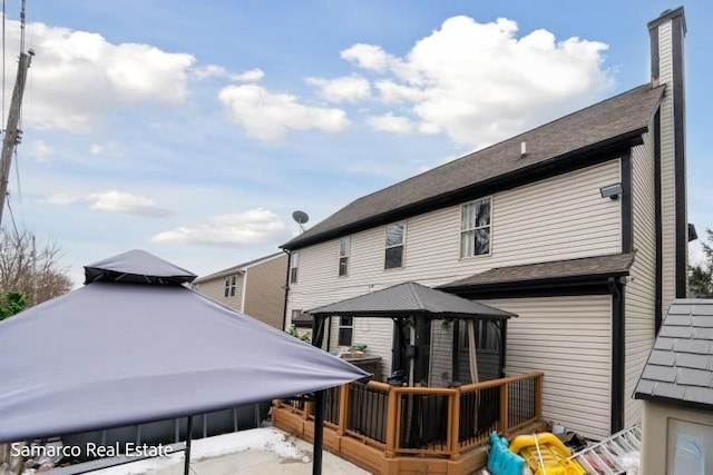 rear view of property with a gazebo