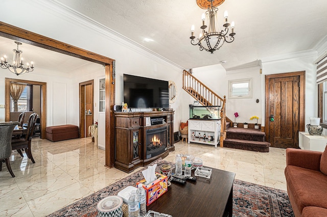 living room featuring a warm lit fireplace, marble finish floor, stairway, and a notable chandelier