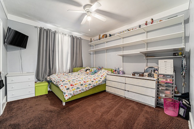 bedroom featuring dark carpet and ceiling fan