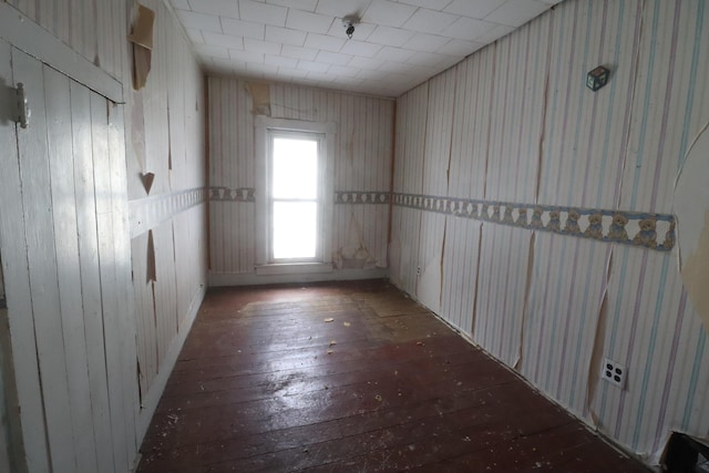 spare room featuring wood-type flooring